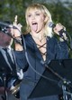 Miley Cyrus flaunts her legs on stage pics