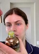 Alexandra Daddario shows makeup in bathroom pics
