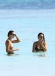 Emily Ratajkowski shows breasts on the beach pics