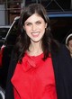 Alexandra Daddario red two-piece and black coat pics
