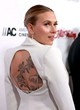 Scarlett Johansson shows cleavge in pantsuit pics