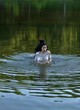 Ashley Boger shows tits in river, wet dress pics