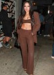 Tinashe shows toned abs in pantsuit pics