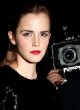 Emma Watson roscks a chic black mini dress pics