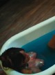 Kelly Rowland lying in bathtub, shows boobs pics