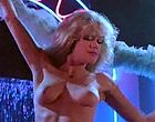 Melanie Griffith stripping topless in thong clips