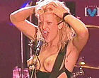 Courtney Love go topless during concert clips
