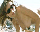 Elizabeth Hurley sunbathes topless clips