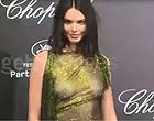 Kendall Jenner braless in a see thru dress clips