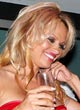 Pamela Anderson showing tits in tops pics