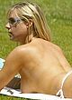 Abi Titmuss sunbathing in bikini & braless pics