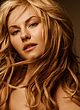 Elisha Cuthbert naked pics - tempts in red lacy lingerie