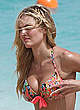 Candice Swanepoel shows deep cleavage in bikini pics
