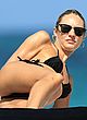 Candice Swanepoel sunbathes in thong bikini pics