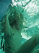 Milla Jovovich showing tits in water tank pics