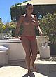 Priscilla Betti naked pics - topless in hotel backyard