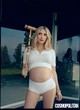 Emma Roberts posing sexy in white outfit pics