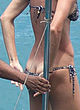 Gisele Bundchen flashes ass crack in bikini pics