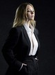 Sydney Sweeney posing in black business suit pics