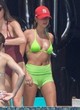 Hailey Bieber stuns in a neon green bikini pics