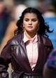 Selena Gomez chic in maroon leather coat pics