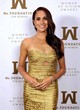 Meghan Markle wows in a gold tight dress pics