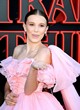 Millie Bobby Brown posing in a pink dress pics