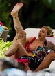 Olivia Buckland naked pics - flashing boob by the pool