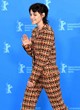 Kristen Stewart posing in chic pantsuit pics