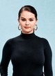 Selena Gomez posing in all-black outfit pics